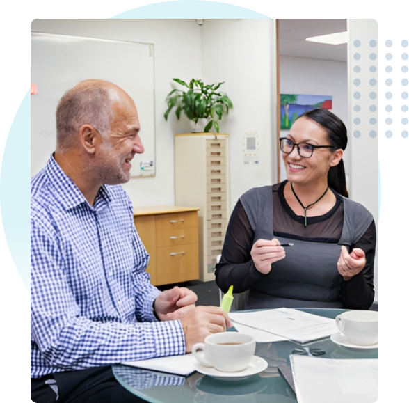 The Integrity Difference A manager and an employee sitting and smiling while the manager takes the employee through a leadership coaching program. New Zealand and Australian Leadership Coaching Training
